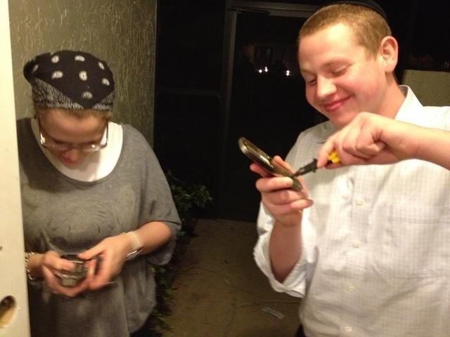 Helping install the shabbos lock.