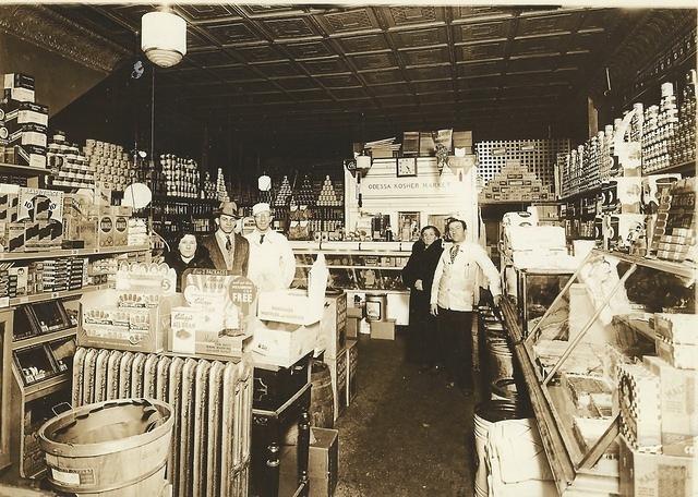 Louis Cohn (delivery boy) with Abe Baellow (butcher) at the Odessa Meat Market, Nov 15, 1936 (front)