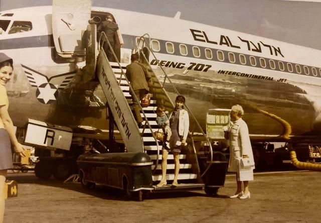 Nechama Steinlauf holding Shlomo.  Making aliyah.